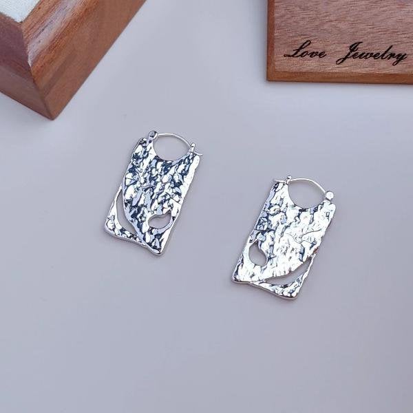 Unieke borddruppeloorbellen - goud en zilver