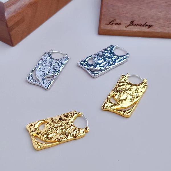 Unieke borddruppeloorbellen - goud en zilver