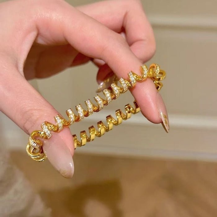 Oogverblindende spiraalvormige link statement armband