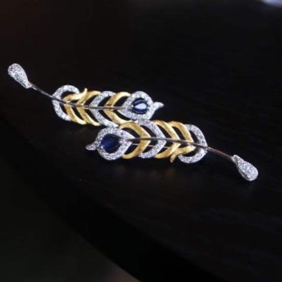 Gevederde pracht saffier broche