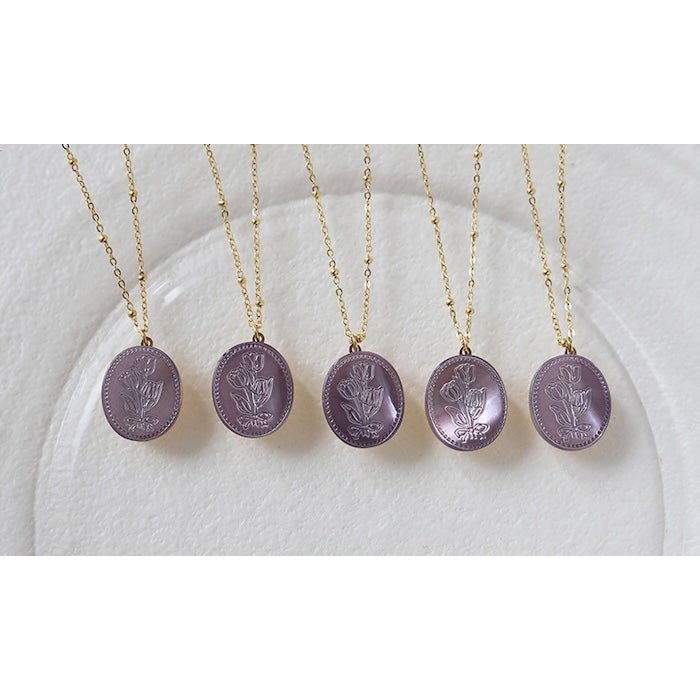 Botanische parelmoer medaillon ketting