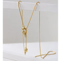 Minimalistische knoop trui ketting