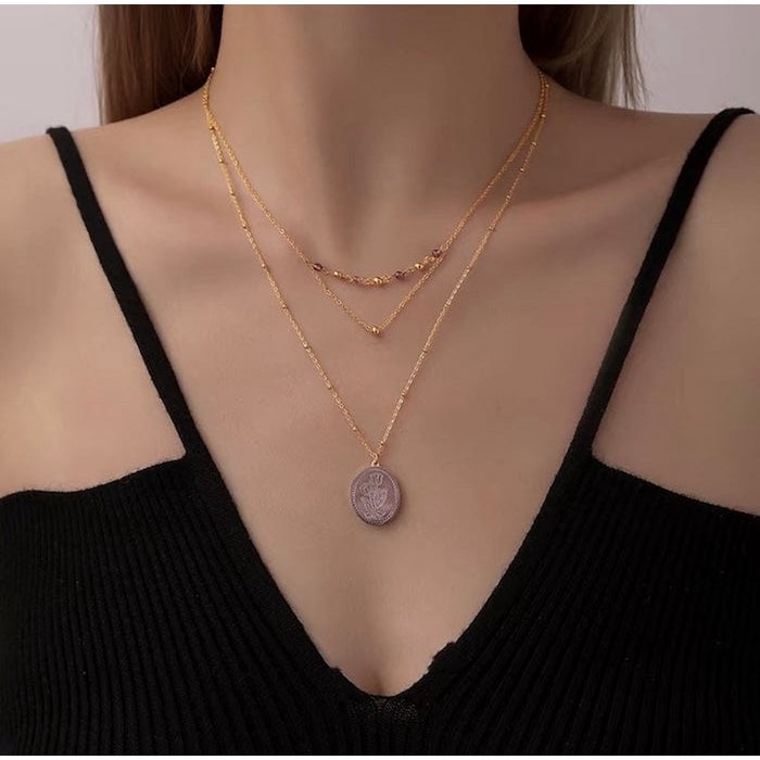 Botanische parelmoer medaillon ketting