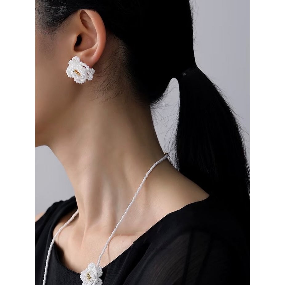 Handgemaakte ketting en oorbellen met madeliefjes