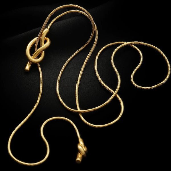 Minimalistische knoop trui ketting