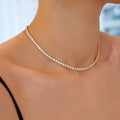 Tijdloze Rivière-chokerketting met diamantlook