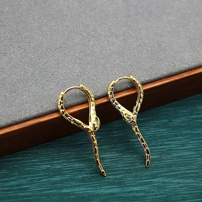 Unieke Green-eye Cobra Design oorbellen - goud en zilver