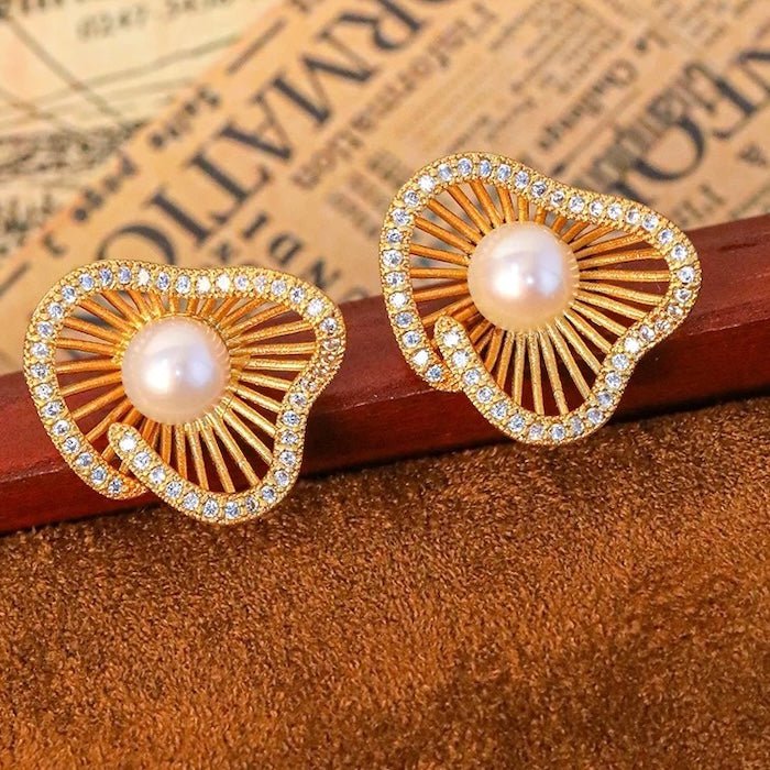 Lotus Design sprankelende pareloorbellen en ringen