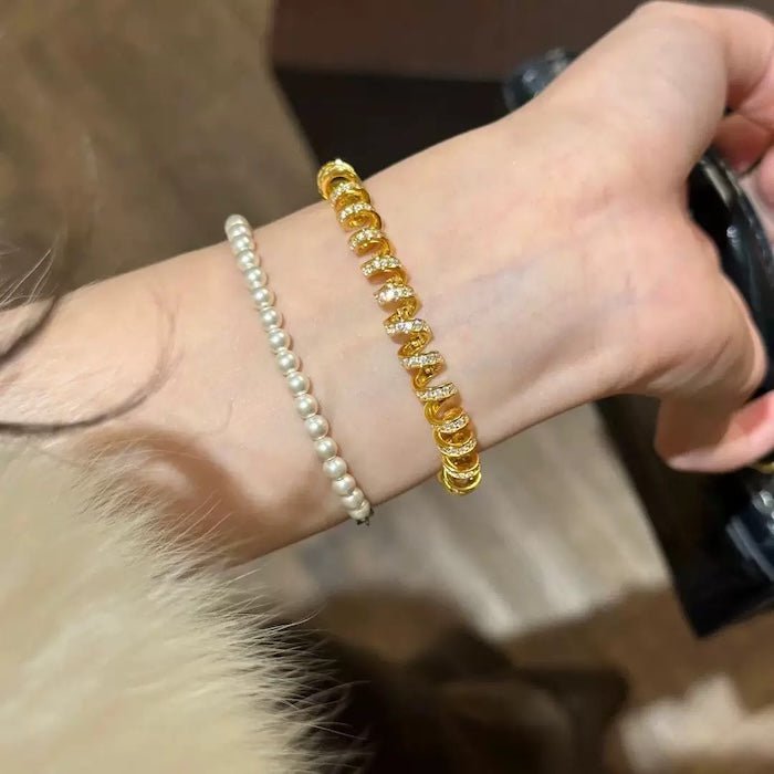 Oogverblindende spiraalvormige link statement armband