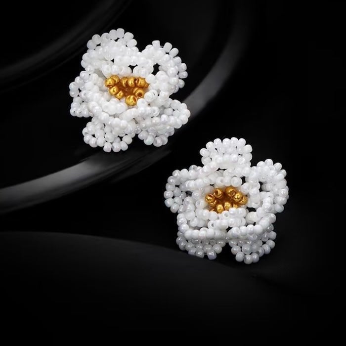Handgemaakte ketting en oorbellen met madeliefjes