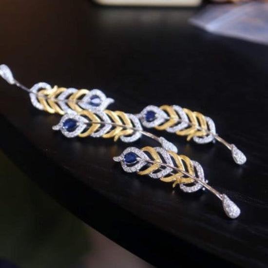 Gevederde pracht saffier broche