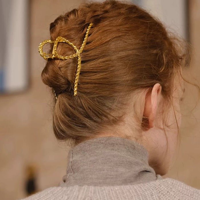 Minimalistische gedraaide lijn grote klauw haarclip