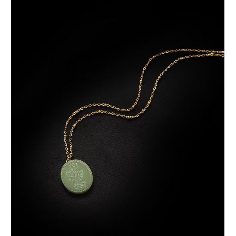 Botanische parelmoer medaillon ketting