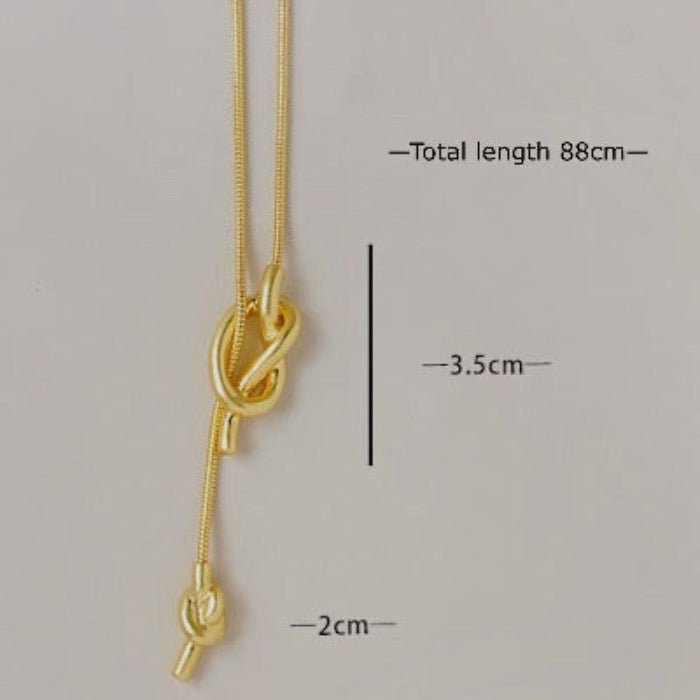 Minimalistische knoop trui ketting