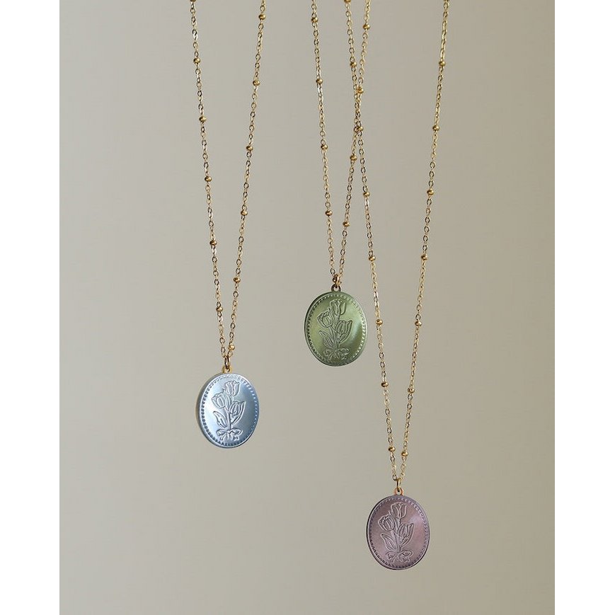 Botanische parelmoer medaillon ketting