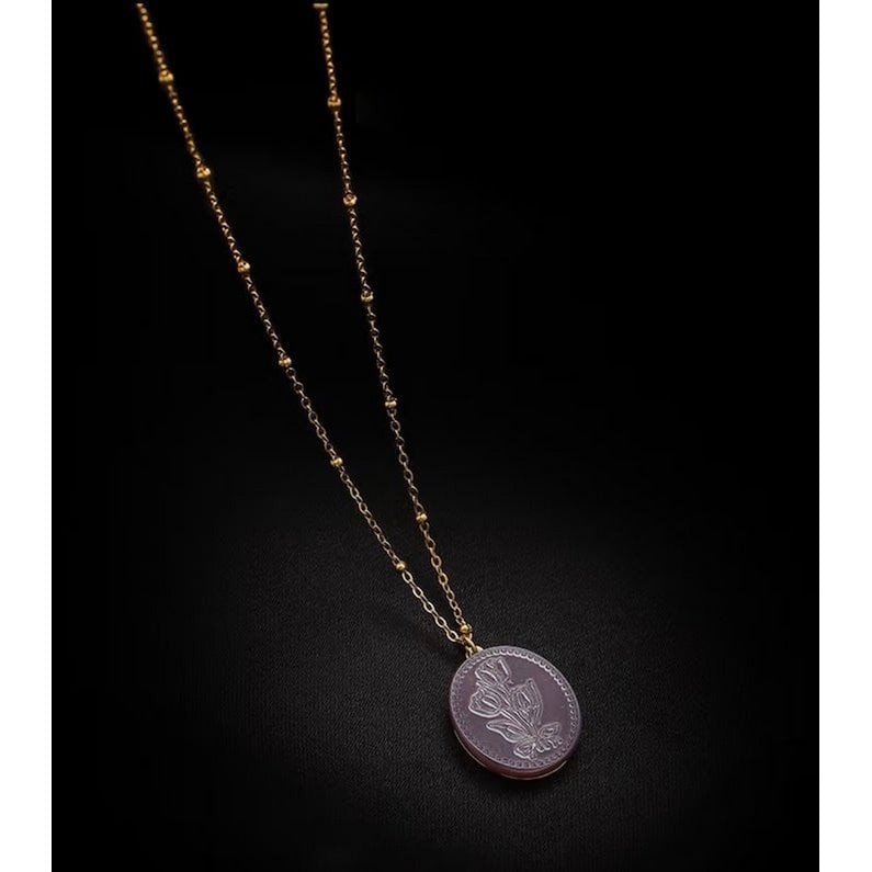 Botanische parelmoer medaillon ketting