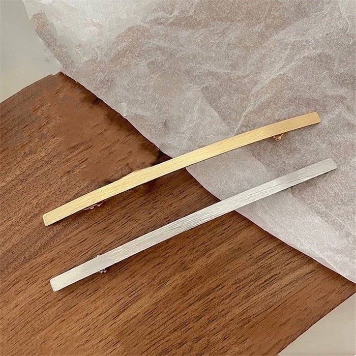 Minimalistische metalen haarclip met één regel